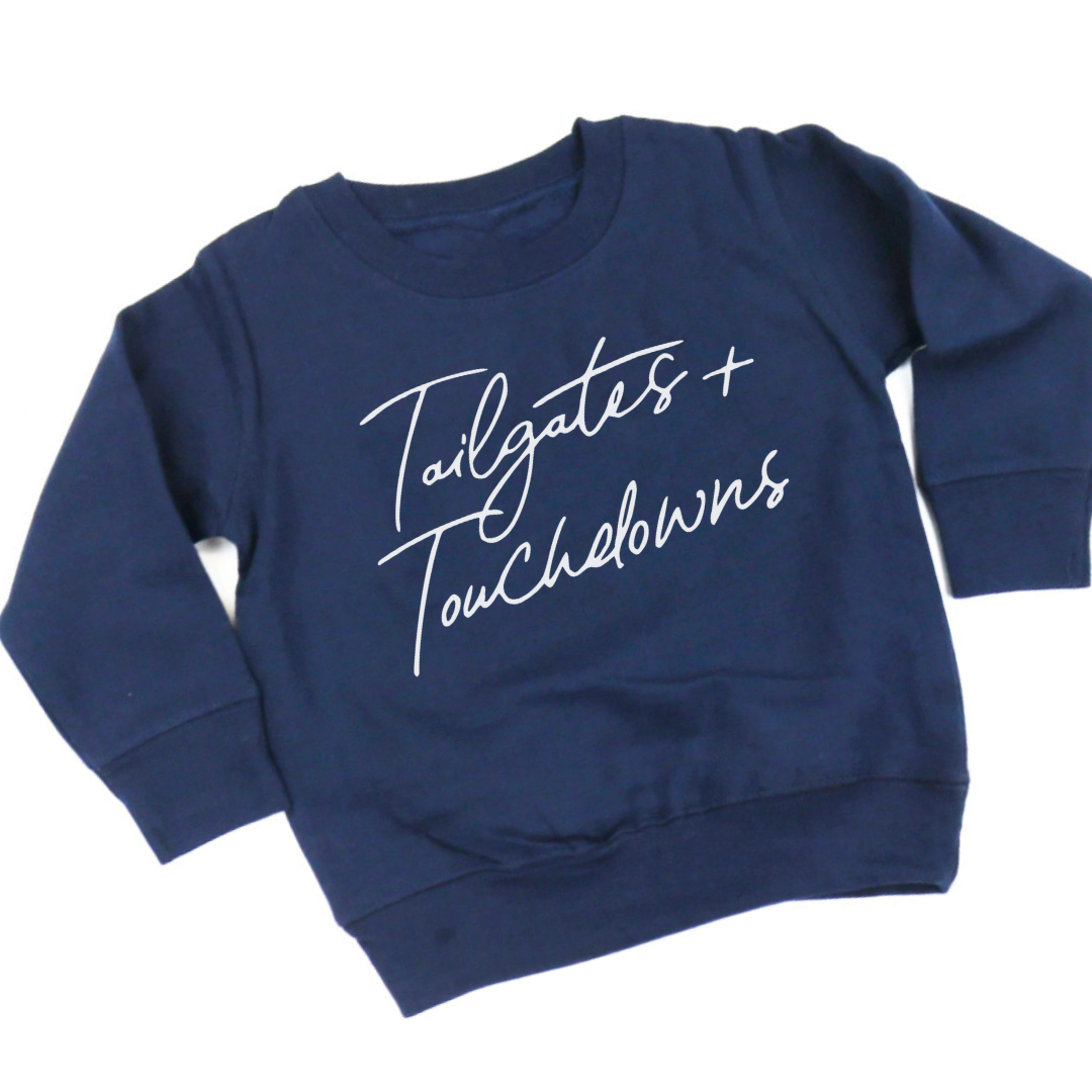 Children's fleece pullover with "Tailgates & Touchdowns" graphic on the front