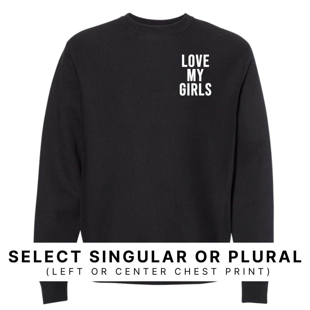 black fleece pullover shown featuring “Love My Girls” in white ink with the design displayed on the left chest.