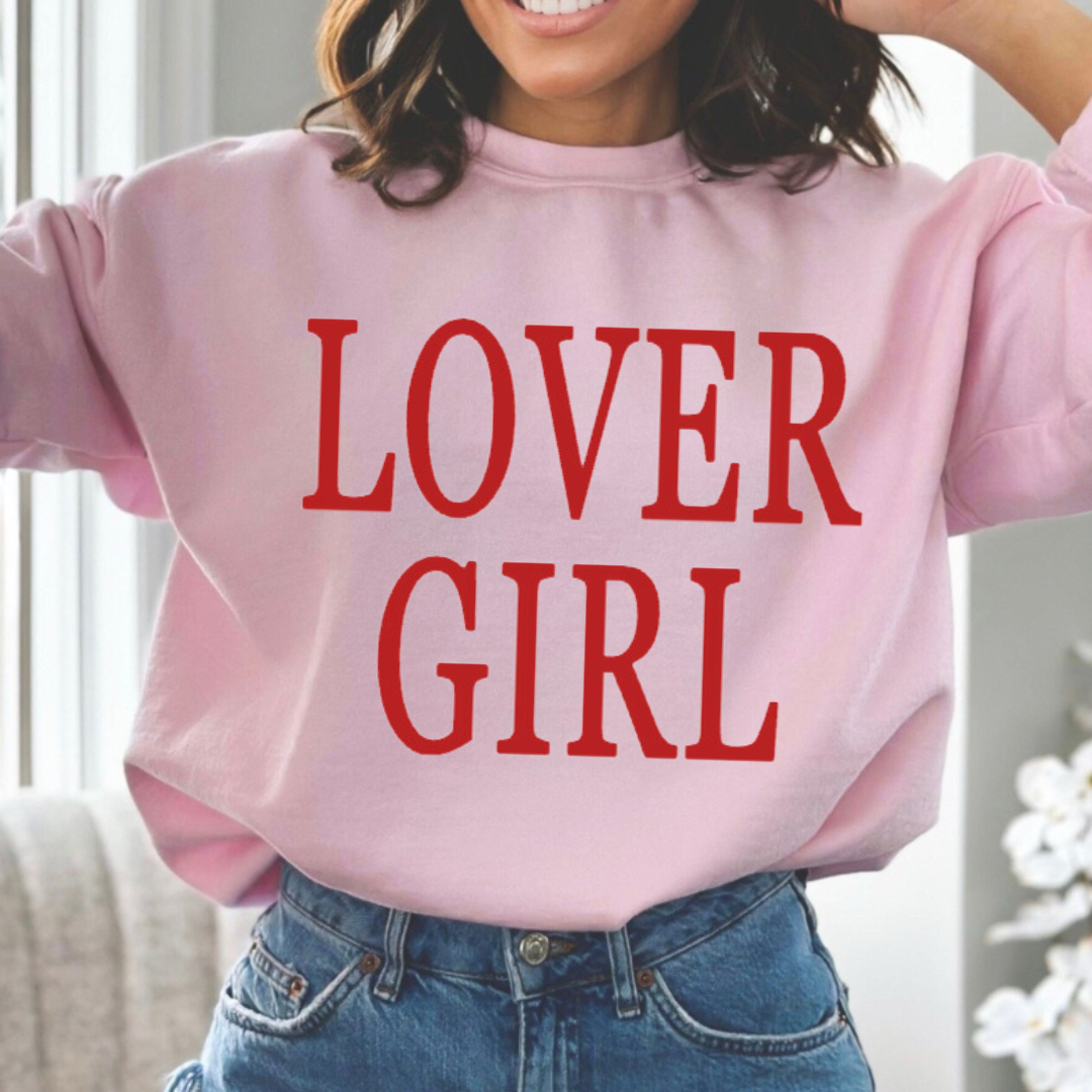 woman wearing a pink fleece pullover with the Lover Girl graphic design