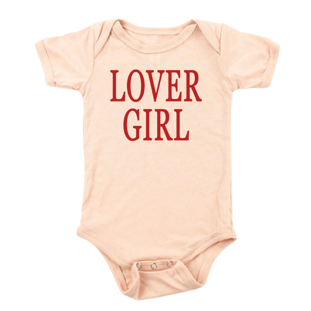 peach colored infant bodysuit with the Lover Girl graphic design