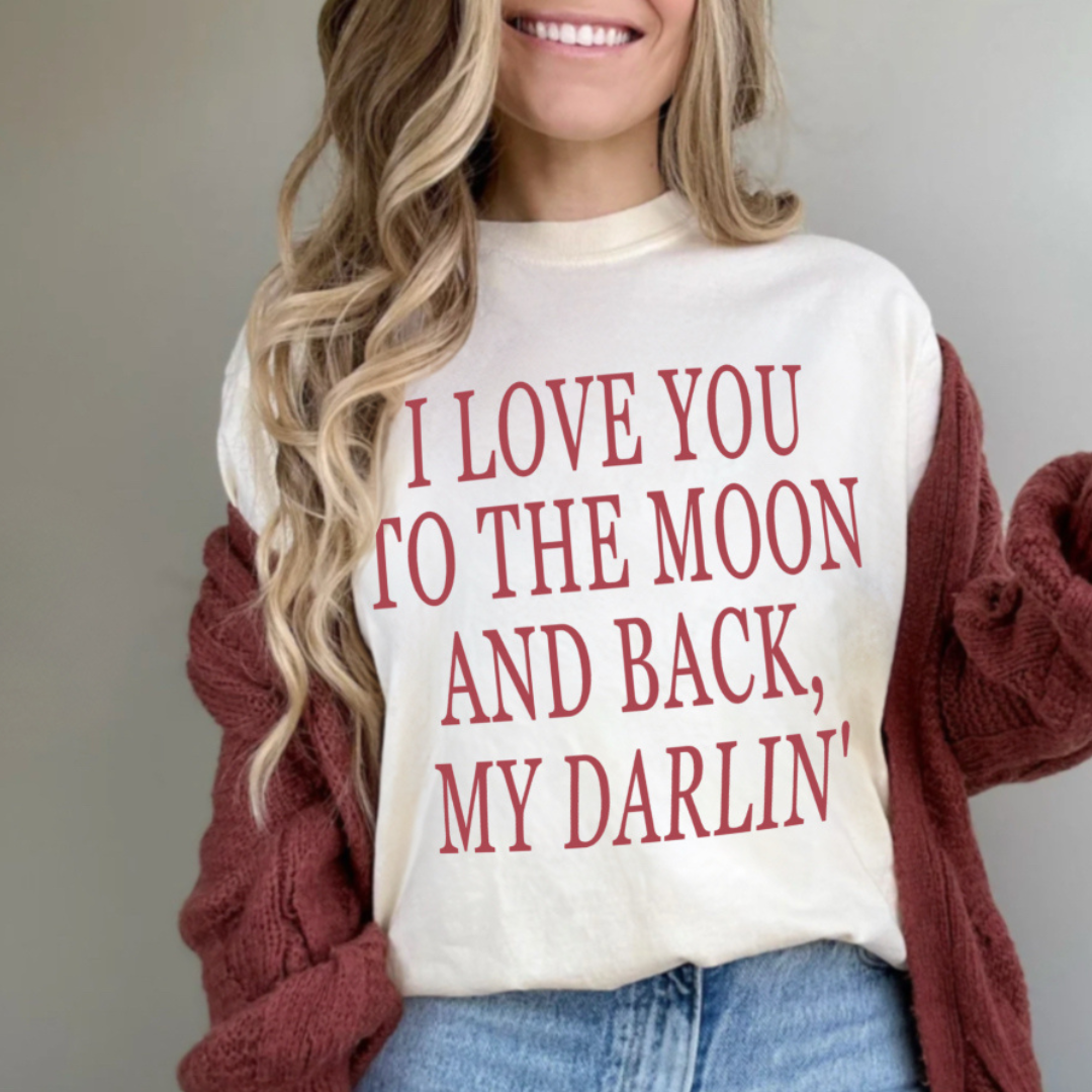 woman modeling our "I love you to the moon and back my darlin' tee"
