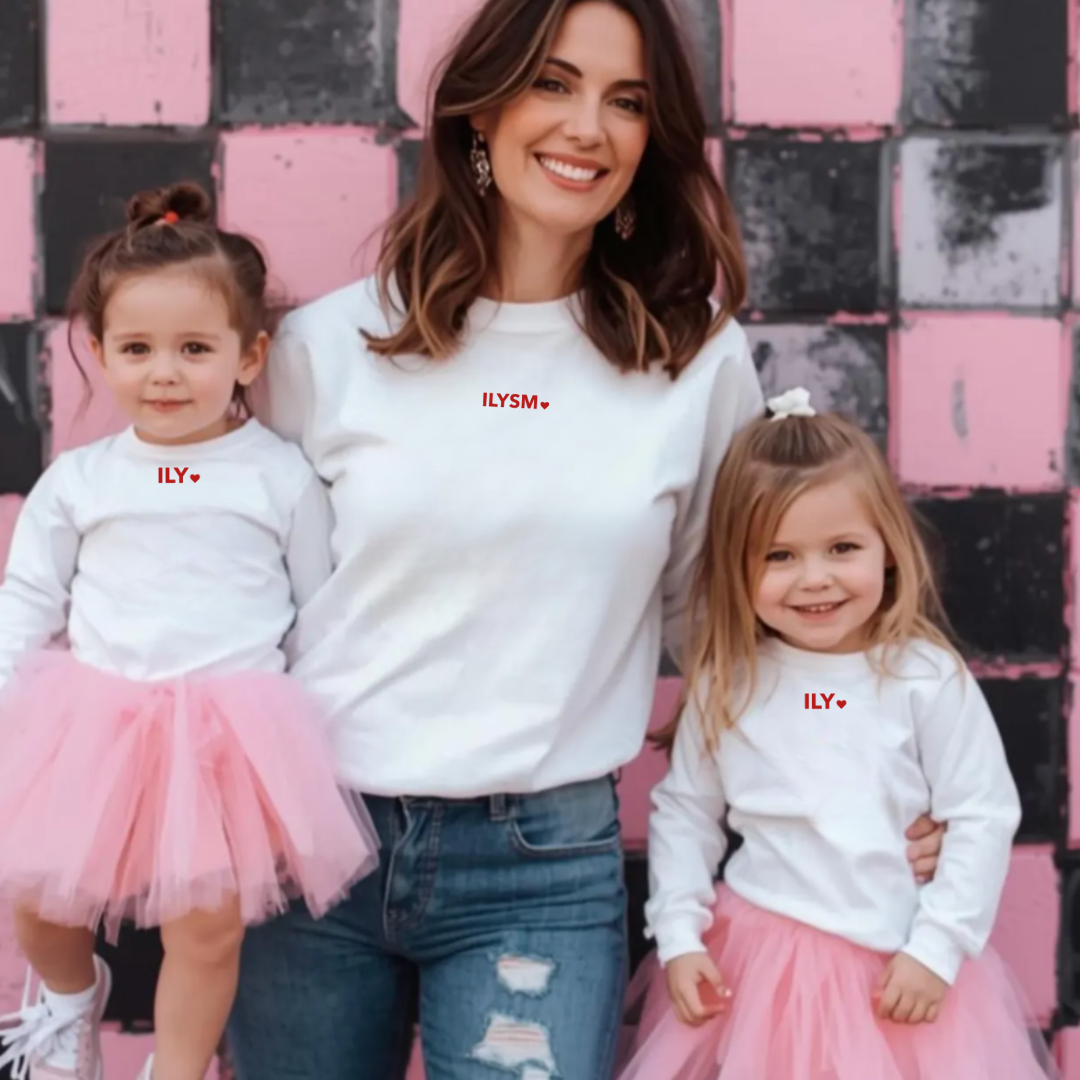 mother with her 2 daughters each wearing a version of the ILY/ ILYSM graphic design