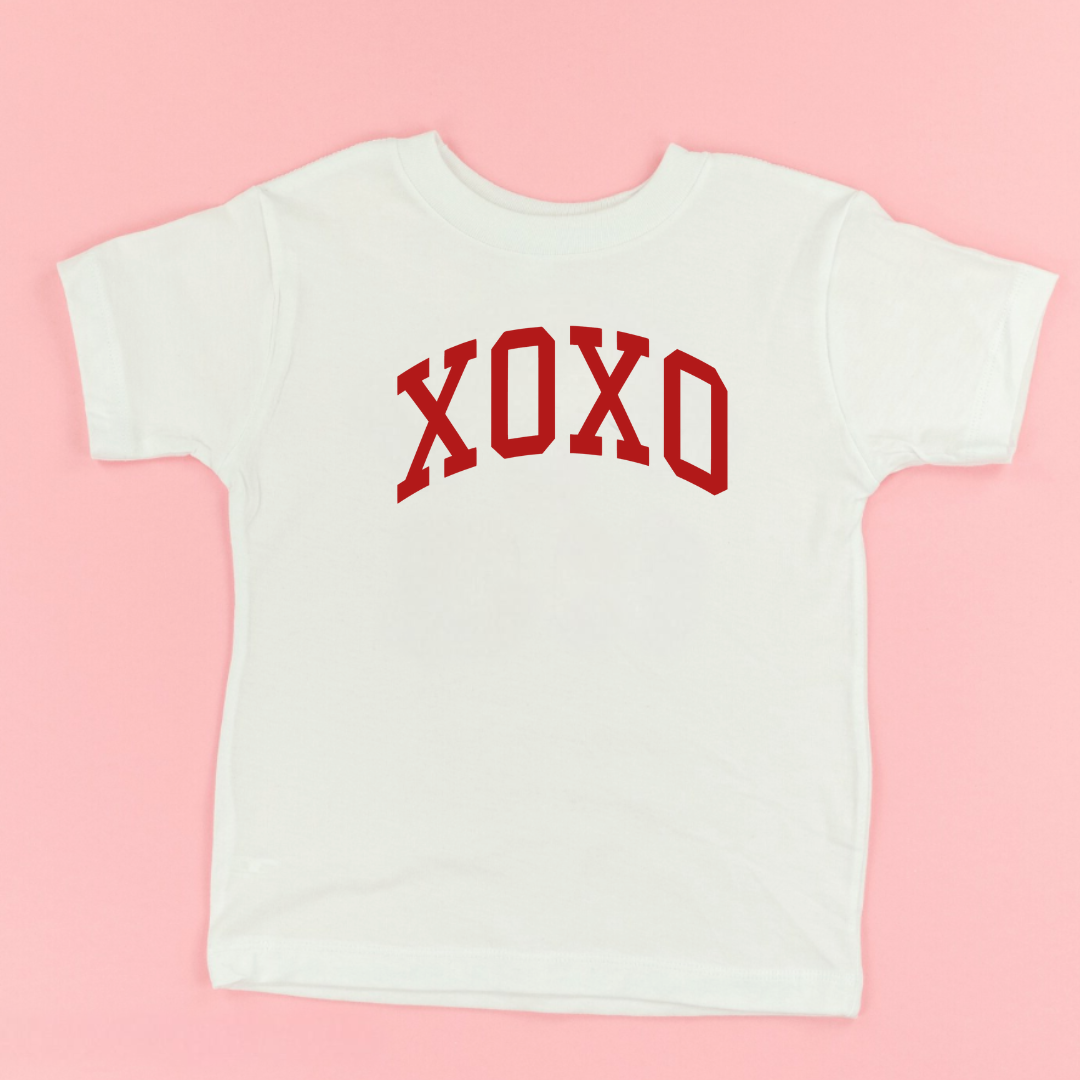 kids natural colored tee with the bold XOXO graphic design in red ink