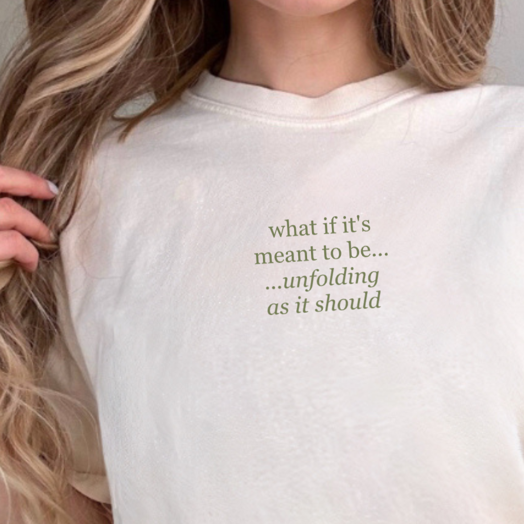 woman modeling Branded & Labeled premium short sleeve tee with a subtke center chest design that reads "what if it's meant to be, unfolding as it should"
