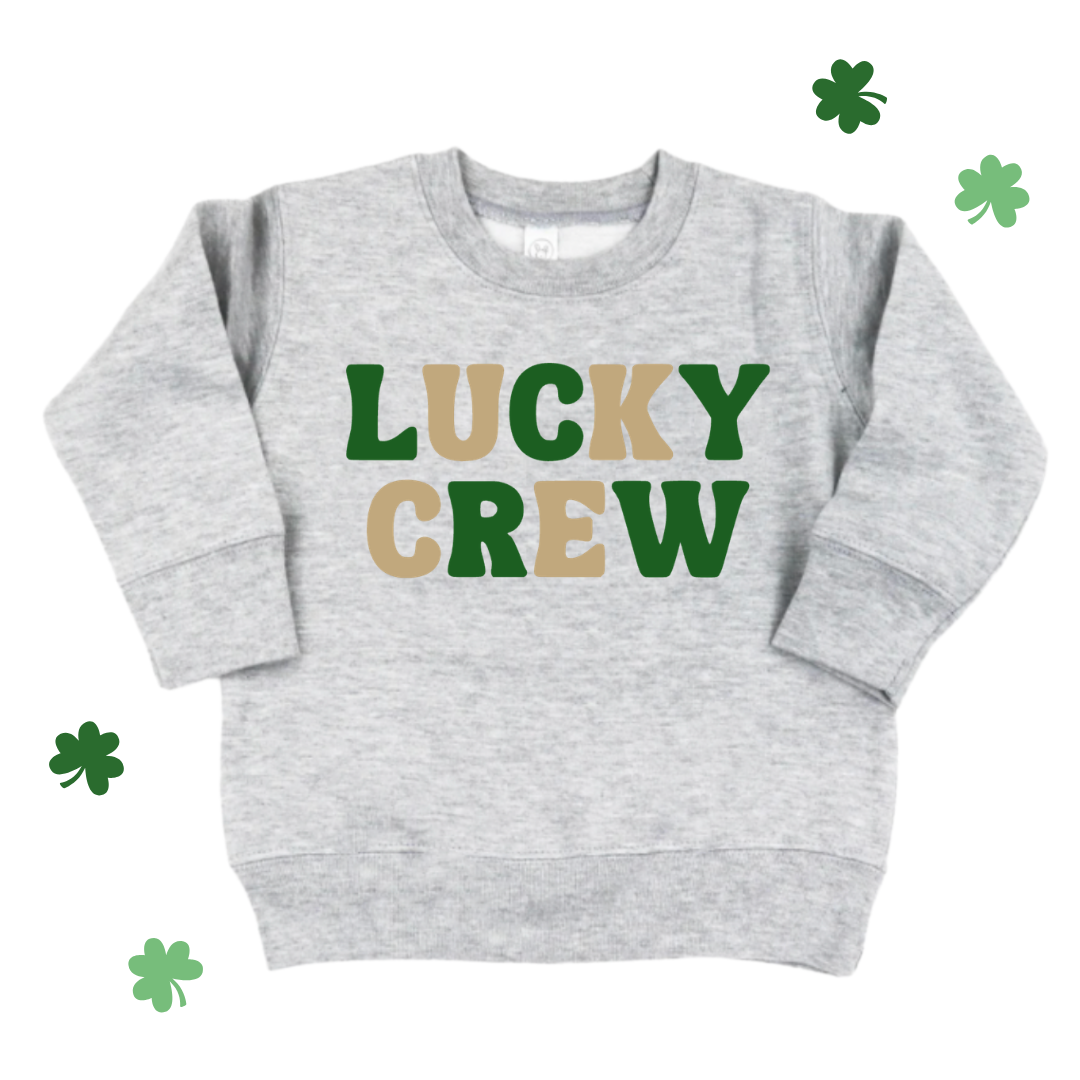 KIDS HEATHER LIGHT GRAY FLEECE PULLOVER WITH "LUCKY CREW" PRINTED ON THE FRONT ALTERNATING EACH LETTER WITH GOLD AND GREEN