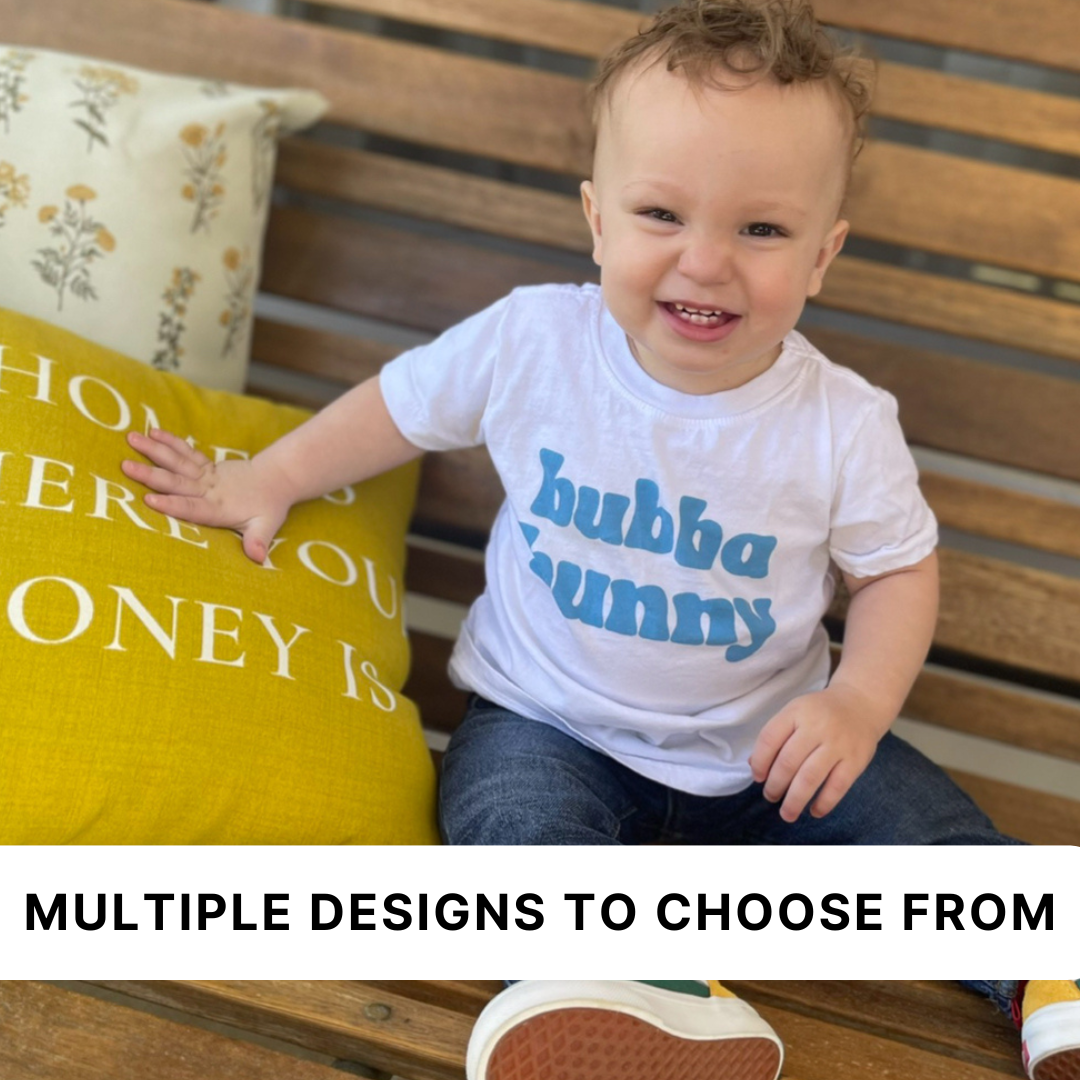 Kids graphic tee featuring customizable bunny nickname designs such as “Bubba Bunny,” “Sissy Bunny,” and “Snuggle Bunny” printed on the front from Branded & Labeled.