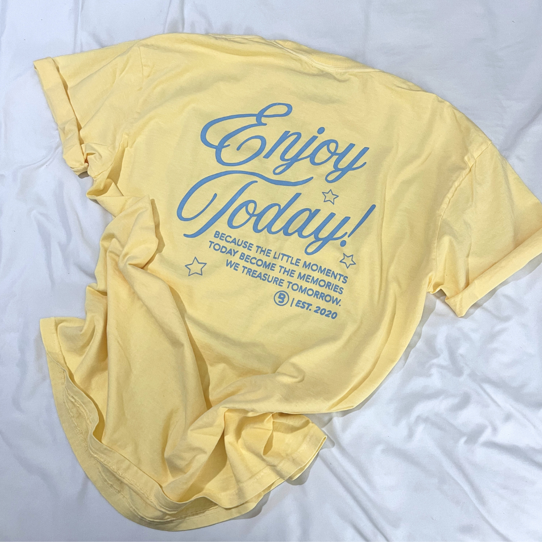 Adult graphic tee featuring the phrase “Enjoy Today – Because the Little Moments Today Become the Memories We Treasure Tomorrow” from Branded & Labeled.