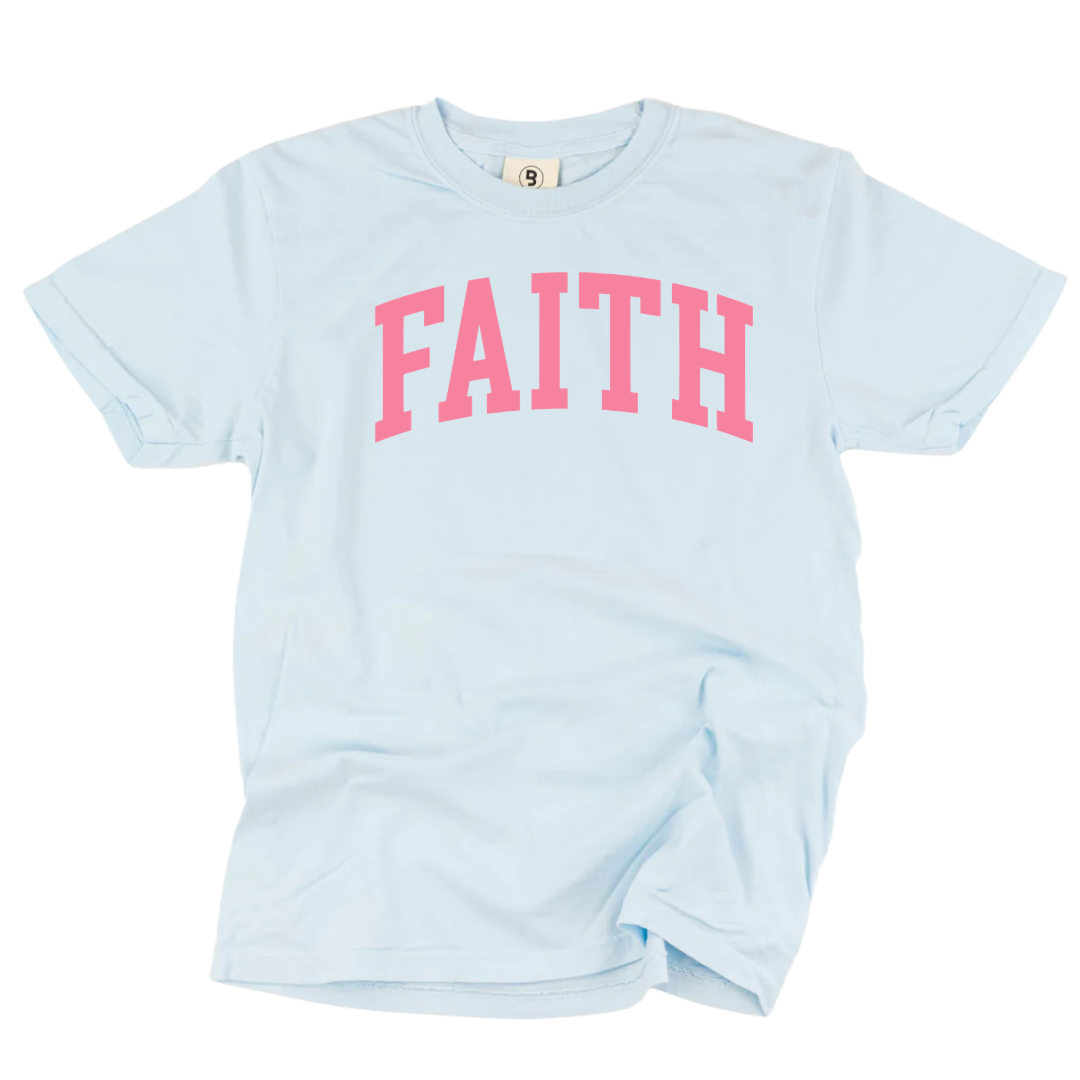 Big Faith graphic tee in sky blue with bold rose pink varsity lettering, premium garment-dyed cotton with soft worn-in feel, spring collection casual tee for women and families