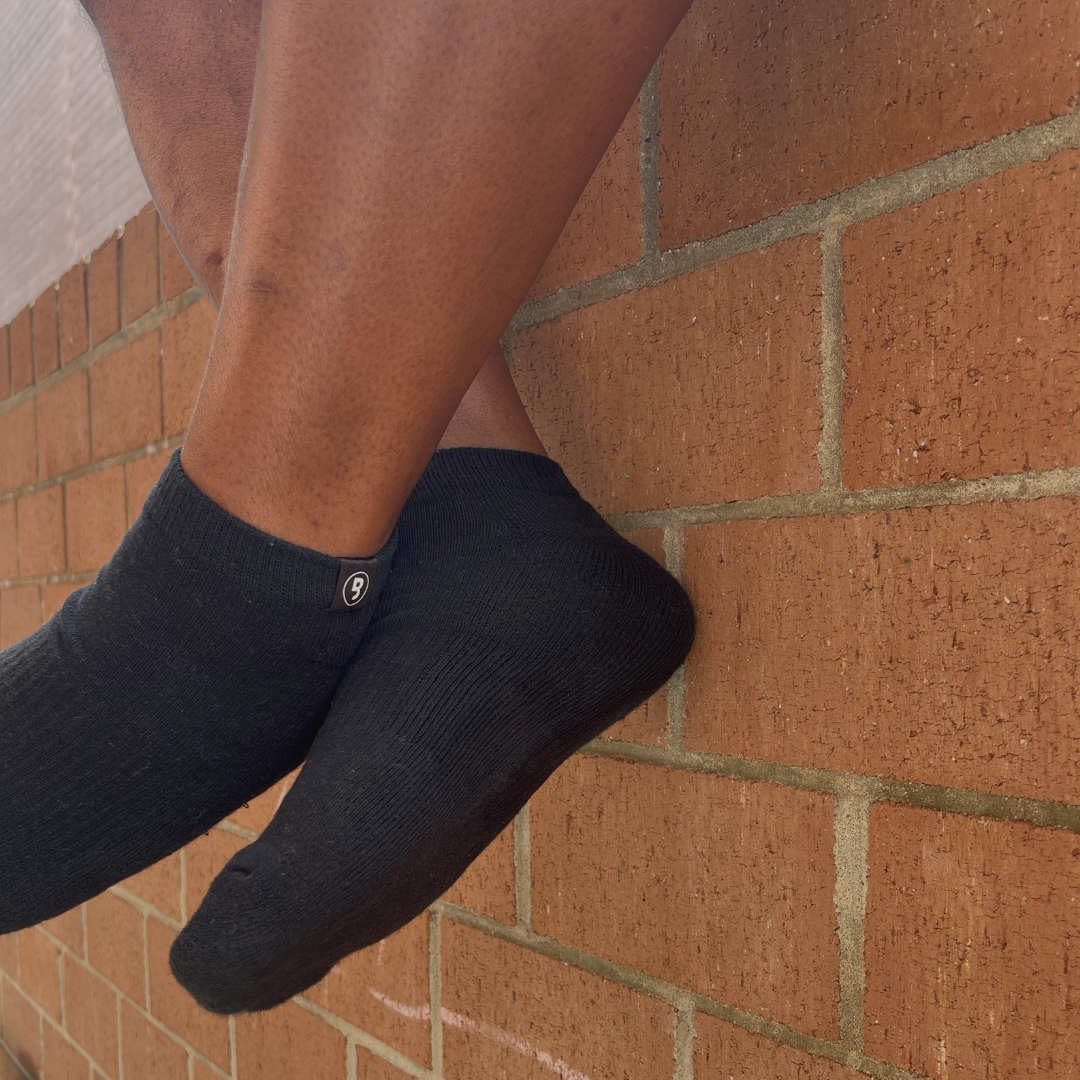 Minimalist black ankle socks with branded cuff detail from Branded & Labeled