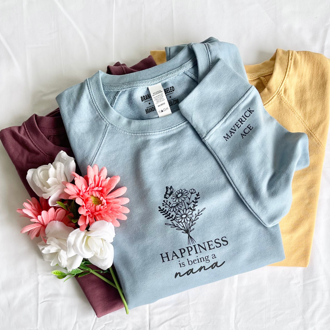 Custom Luxe Terry Crew featuring “Happiness is being a [name]” on the front with personalized children or grandchildren names printed on the sleeve from Branded & Labeled.