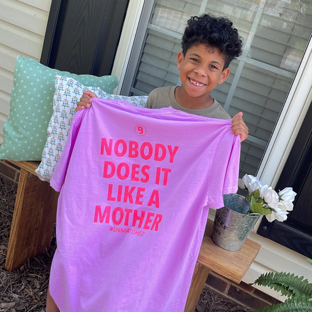 Signature Branded & Labeled "Unmatched" tee featuring text that reads "Nobody does it like a mother" on the back