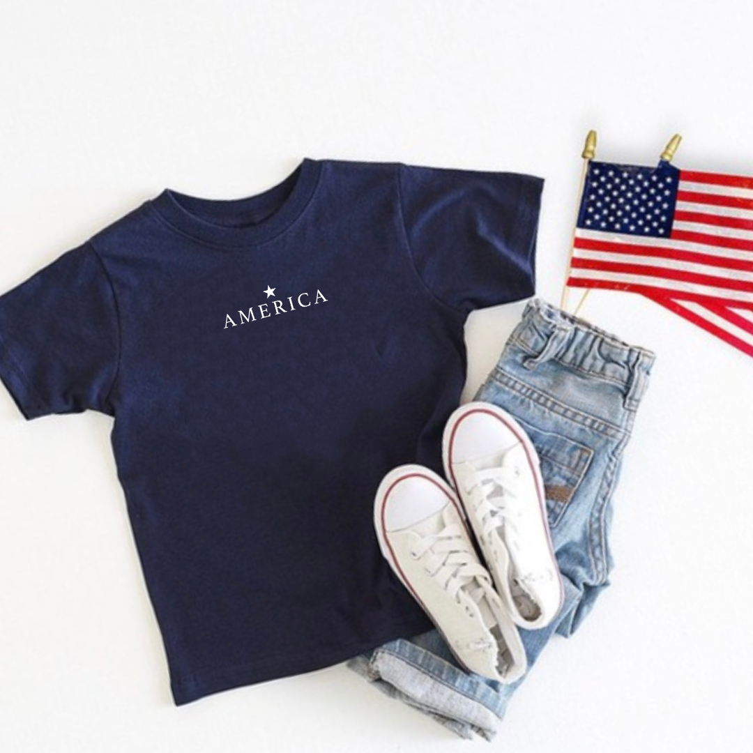 Kids graphic tee featuring a subtle vintage-inspired “America” design with a single star printed near the collar, part of the American Classics Collection by Branded & Labeled.