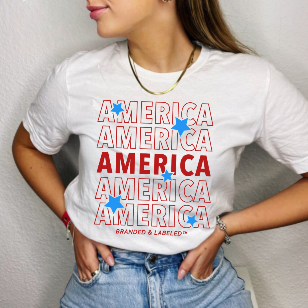 Adult everyday graphic tee featuring repeating “America” text with playful stars in a patriotic-inspired design, part of the American Classics Collection by Branded & Labeled.