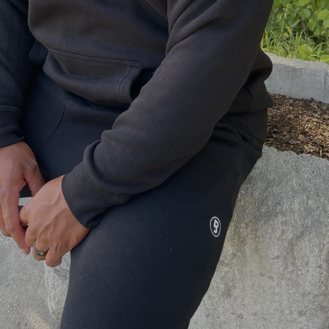 Black unisex fleece joggers featuring signature B logo detail