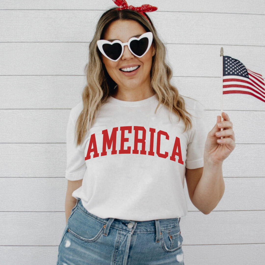Adult everyday graphic tee featuring oversized varsity-style “America” lettering, part of the American Classics Collection by Branded & Labeled.