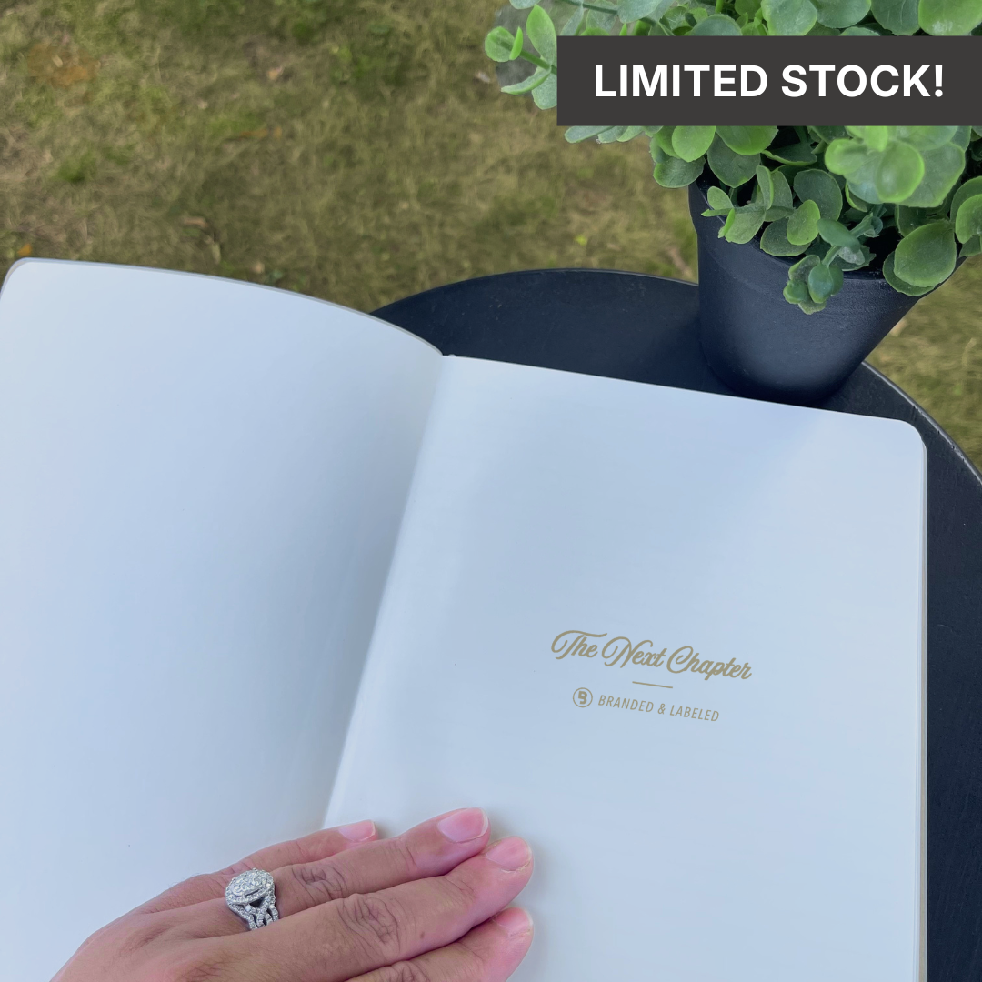 Light gray B5 size journal with a premium cover featuring “The Next Chapter” in shimmer gold lettering and “Branded & Labeled” printed underneath.