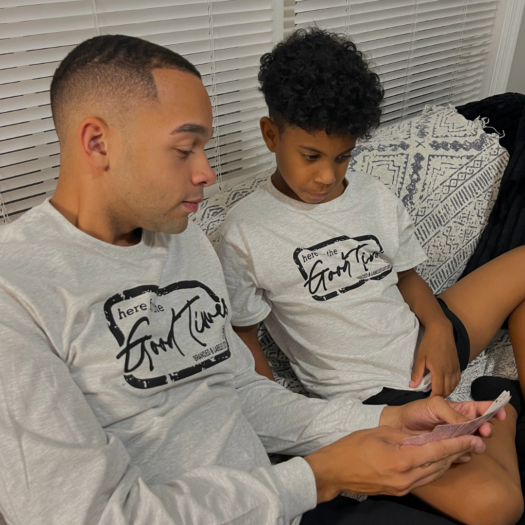 Man wearing the Good Times Core Long Sleeve alongside a boy wearing the matching Here for the Good Times graphic tee from Branded & Labeled